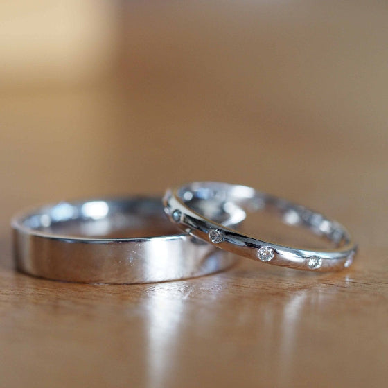 platinum wedding ring with equally spaced diamonds