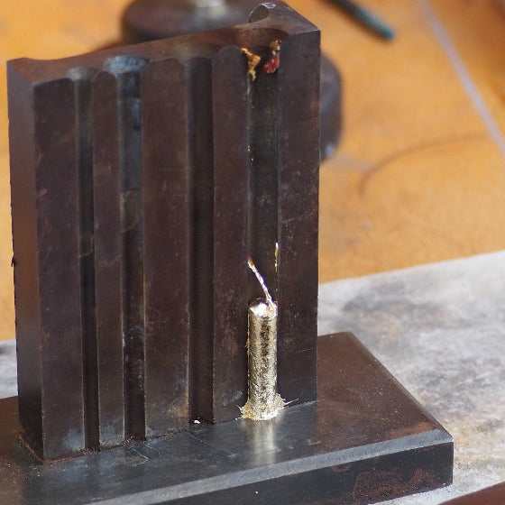 yellow gold poured into mould