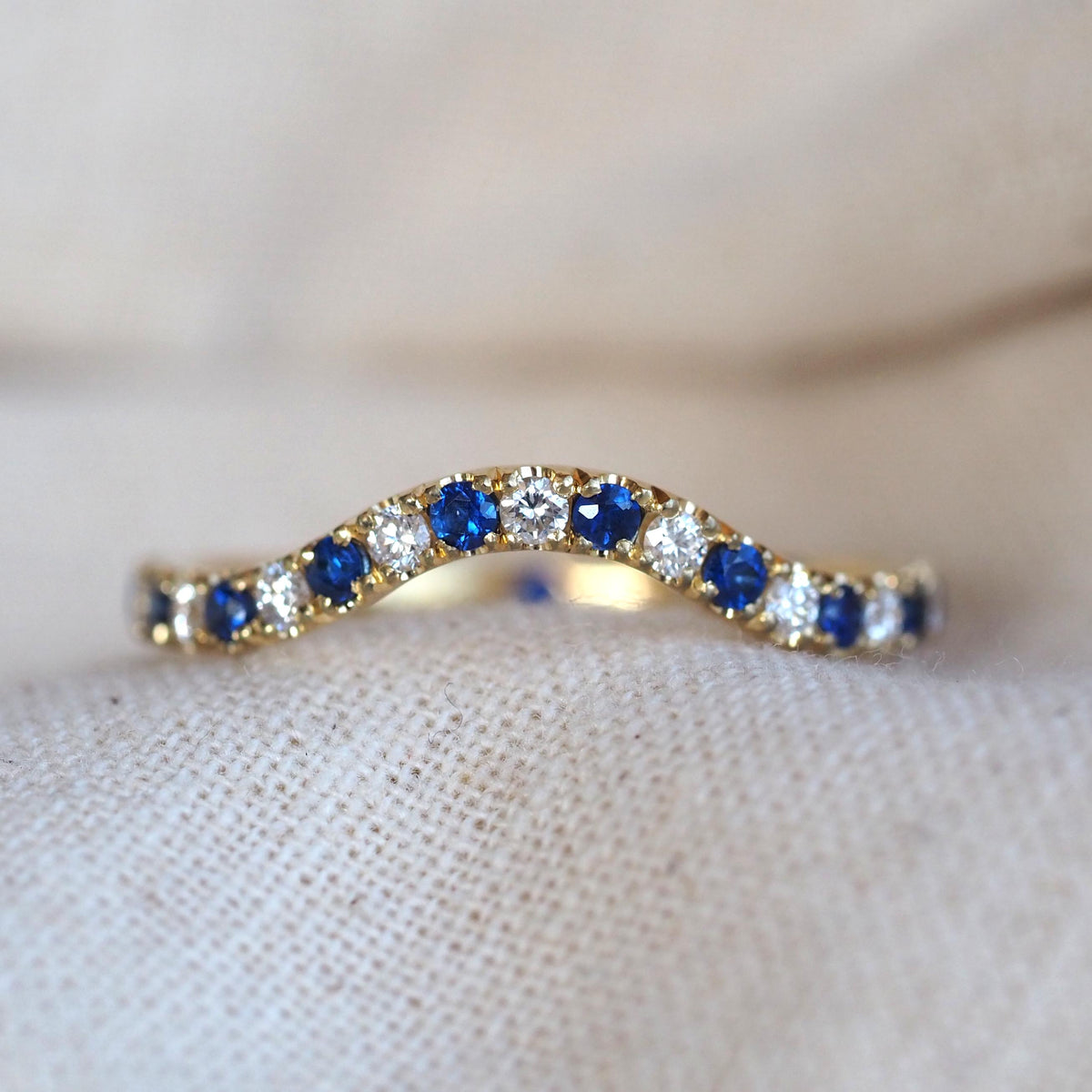 Blue sapphire and diamond shaped wedding band