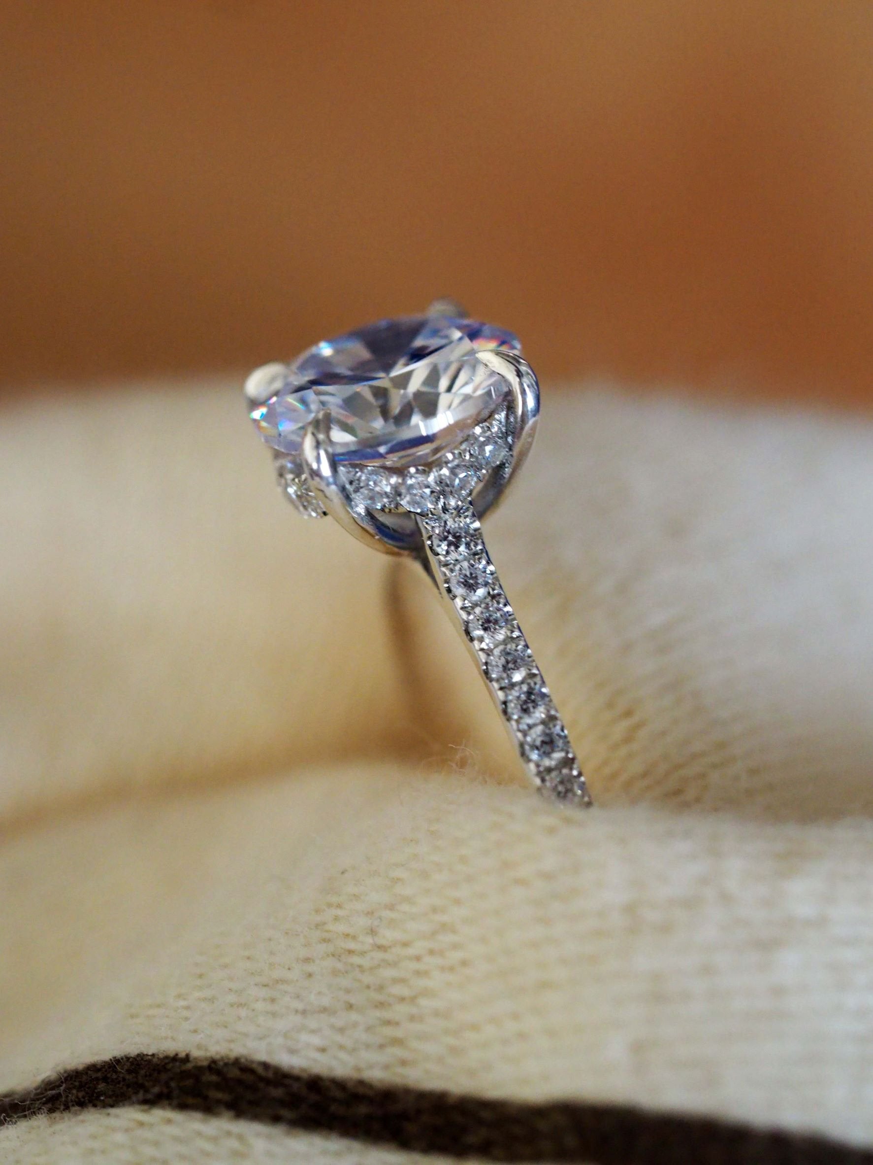 Hidden halo oval engagement ring