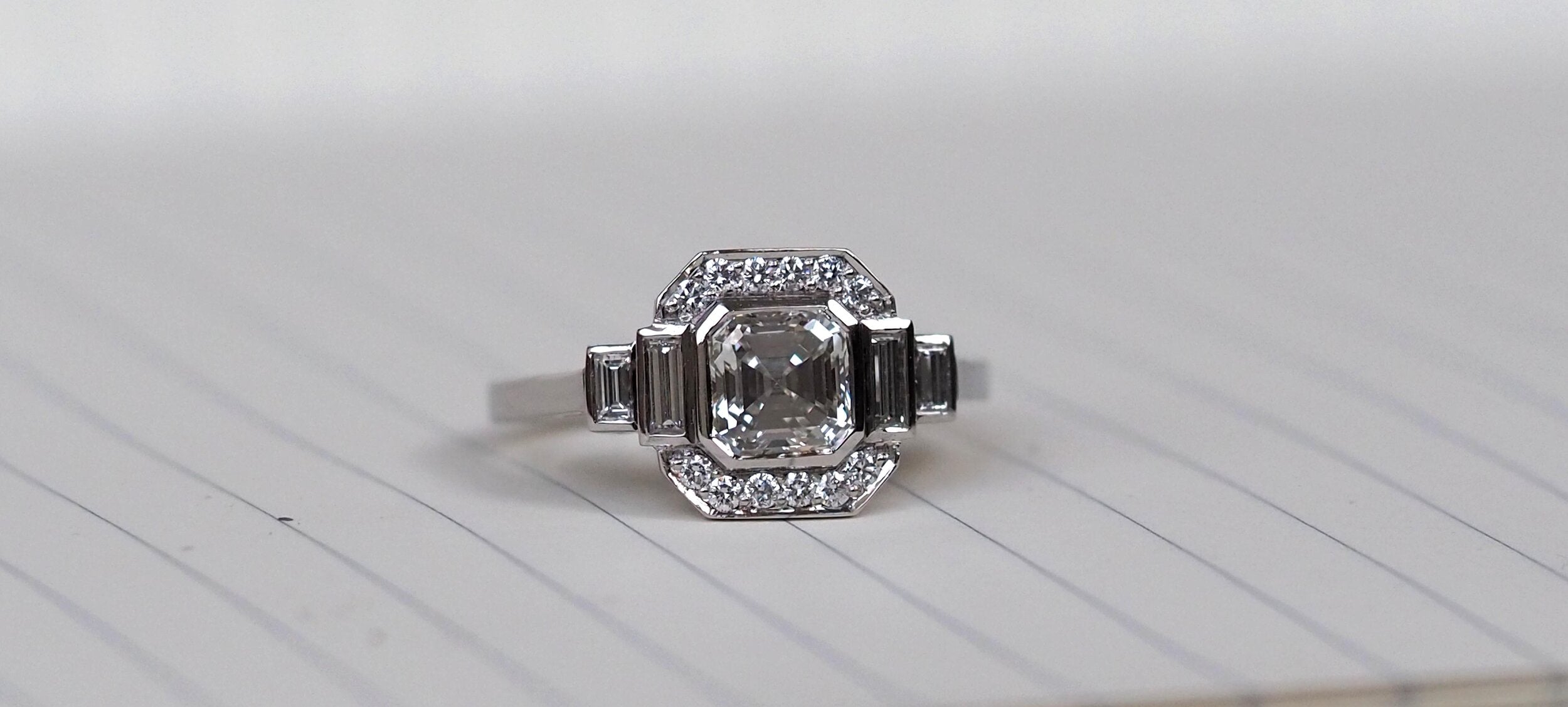 Platinum, Asscher and baguette cut diamond engagement ring