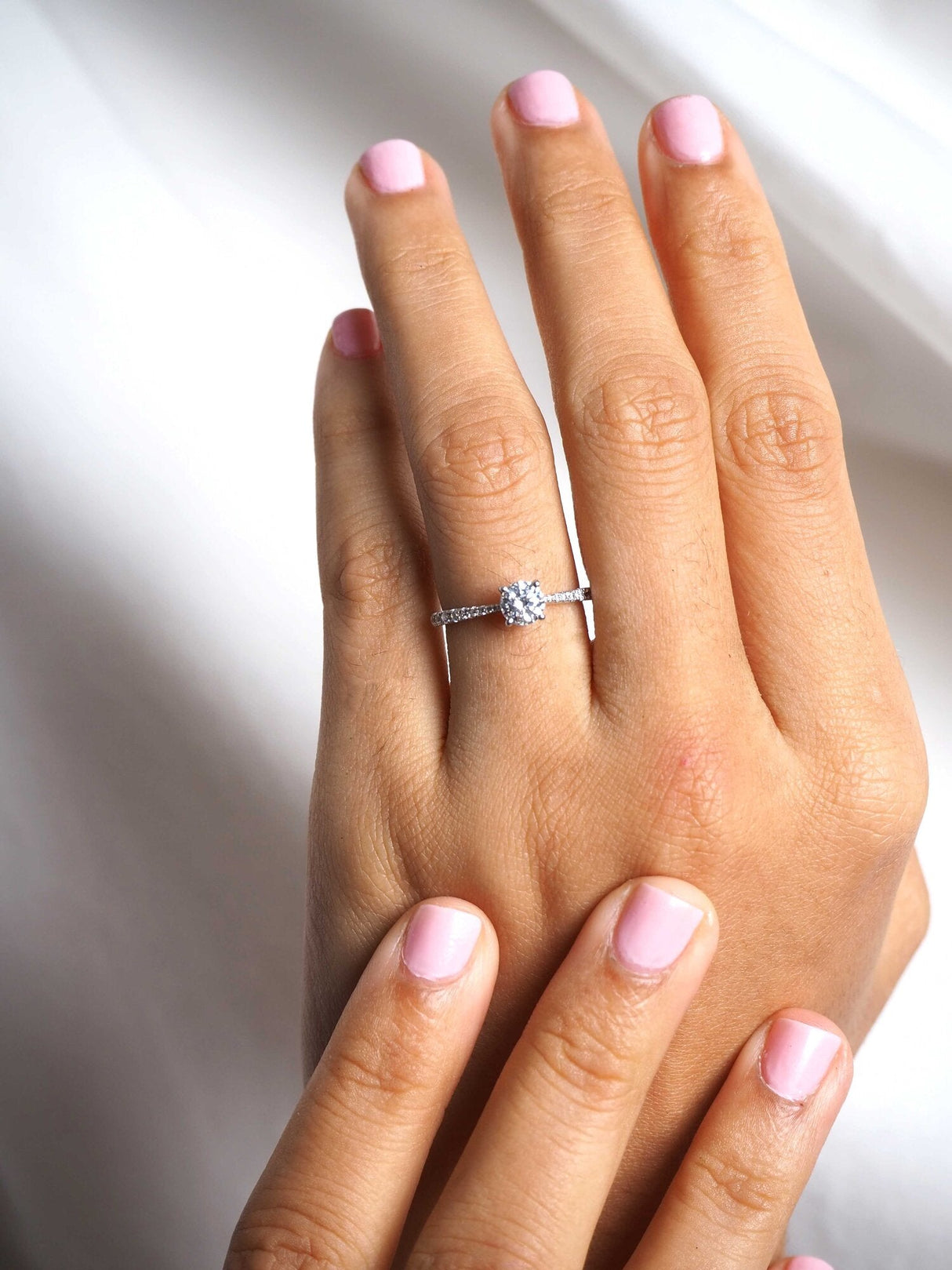 0.60ct Round diamond ring with diamond shoulders