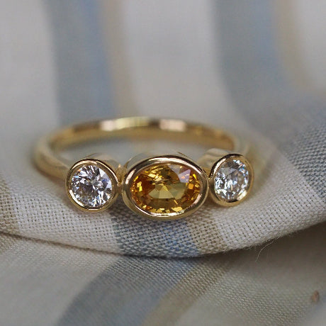 Yellow sapphire and diamond ring in 18ct yellow gold