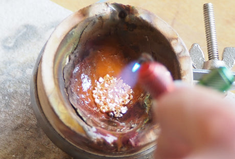 melting yellow gold grain